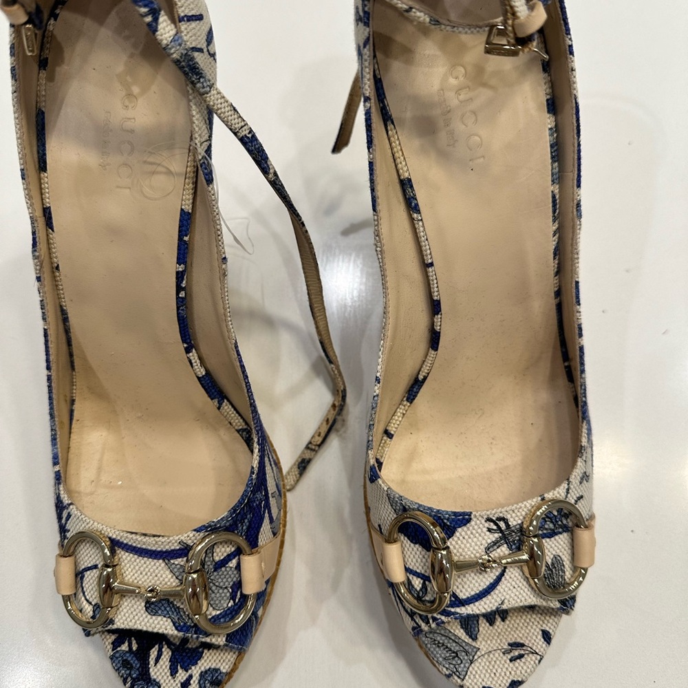 Gucci blue and cream colored platform heel with gold bar.